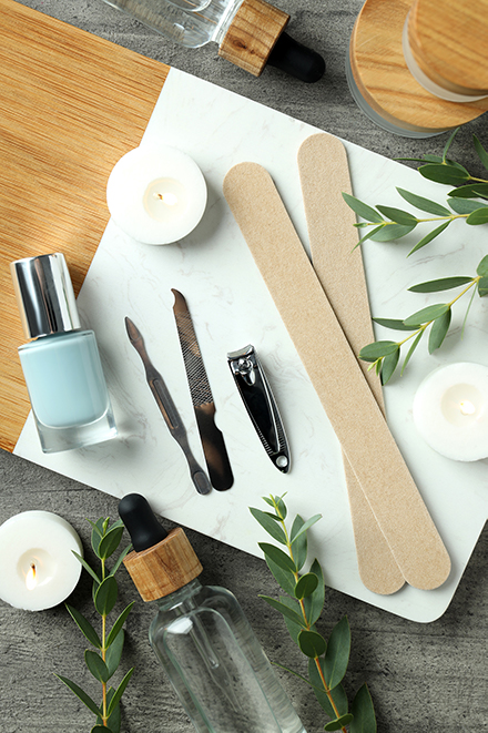 concept-of-nail-care-with-manicure-accessories-on-wooden-background.jpg